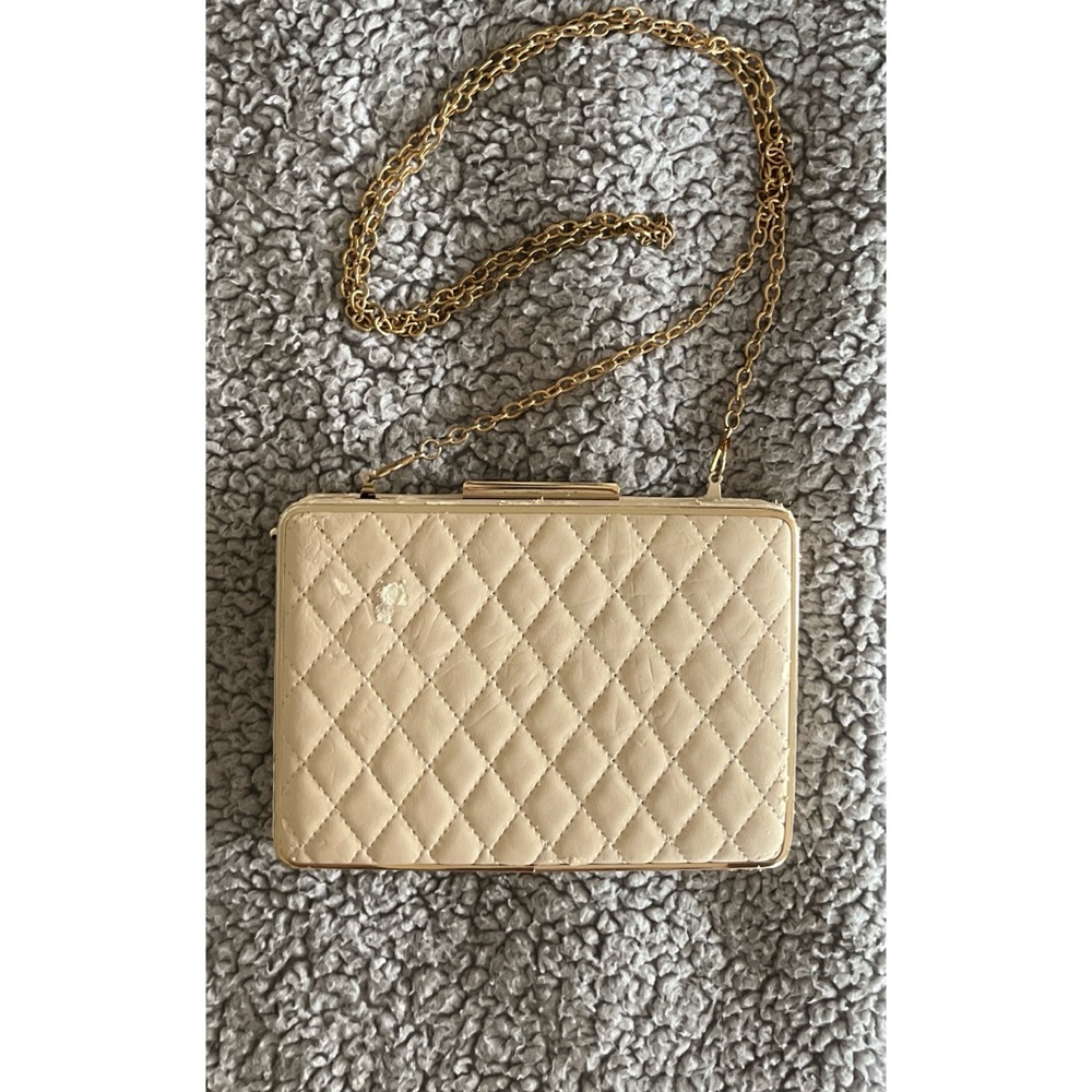 Lulu’s Elegant Quilted Cream Clutch Bag with Detachable Gold Chain.